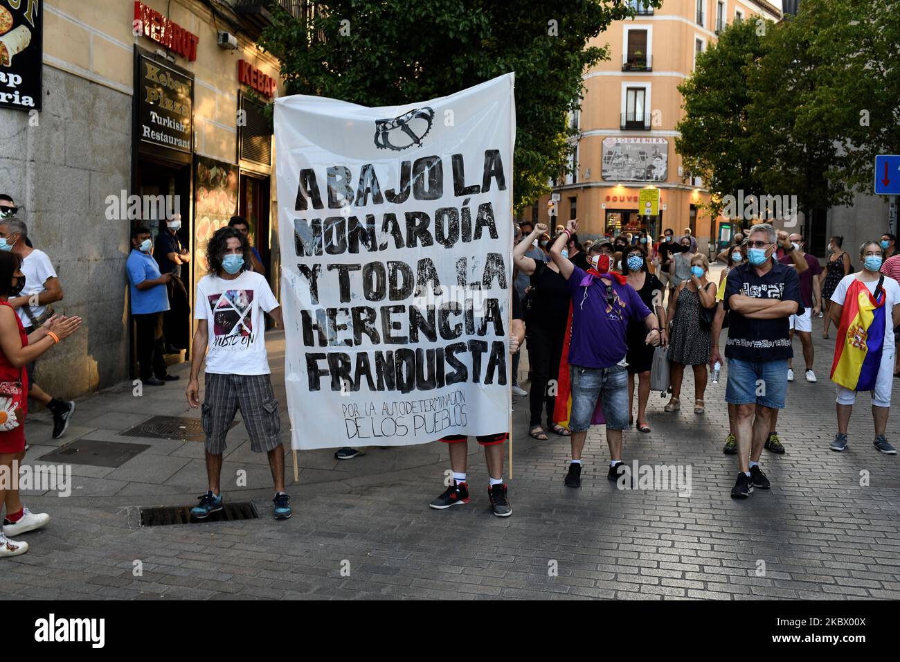 A protesters man holding a placard during a demonstration against the Spanish Monarchy under the header `Down with the monarchy and all the Franco dictatorship heritage´ in Madrid on 9th August, 2020. (Photo by Juan Carlos Lucas/NurPhoto) Stock Photo